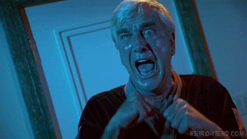 A GIF of a man screaming in a horror movie.