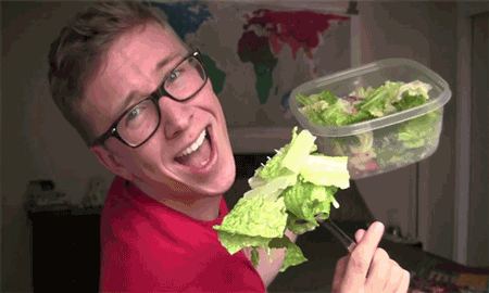 a man eating salad