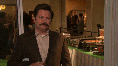Ron Swanson standing in front of a buffet stating, 'I've said too much.'